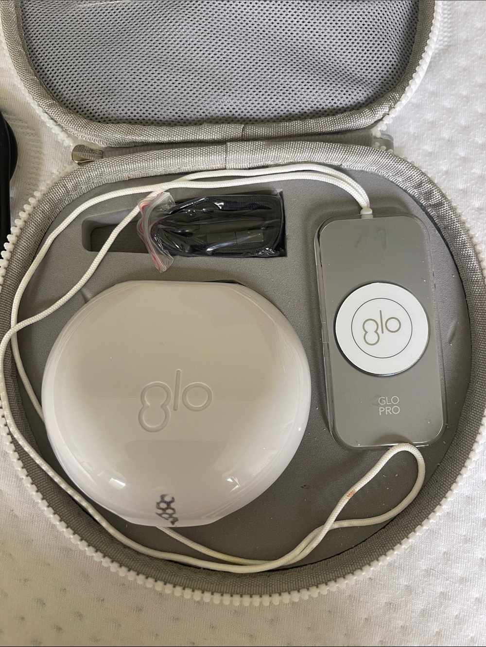 GLO  tooth whitener  and  Travel Case only used twice. Sanitized
